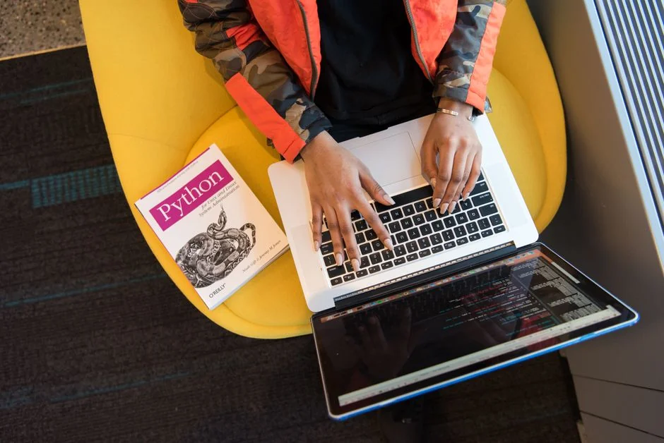 A focused designer is working on a user-centered project in a contemporary office setting.